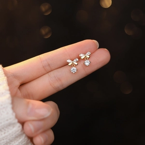 S999 silver bow earrings with sparkling zirconia tassels and elegant golden finish