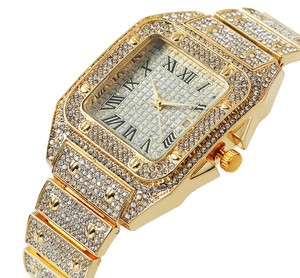 Macro detail of luxury square gold watch with Roman numerals and full crystal stones