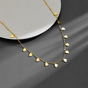 Chic gold stainless steel necklace featuring minimalist heart-shaped dangling pendants