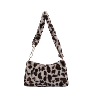 Stylish leopard print plush shoulder bag with white accent strap rings on white background