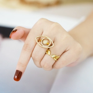 Gold evil eye and leaf open rings with crystals worn on finger for fashion
