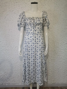 Detail of square neckline with drawstring and puff sleeves on floral midi dress