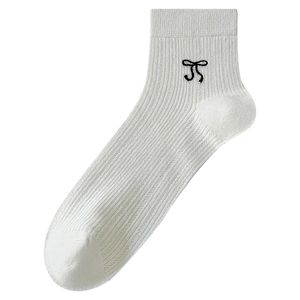 White ribbed knit crew socks featuring a minimalist black bow embroidery on clean background