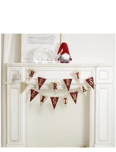 Detail of red and black plaid burlap banner with Merry Christmas gold lettering