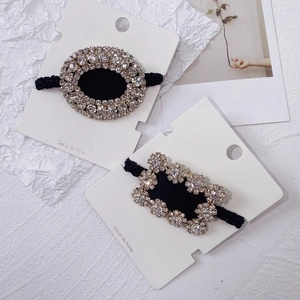 Detail of luxury rhinestone hair ties with sparkling crystals on elastic bands