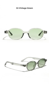 Detail view of translucent gray oval sunglasses with C6 vintage green lenses and metal rivets