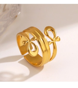 Detailed close-up of a double-layered 18K gold-plated cross knot adjustable ring