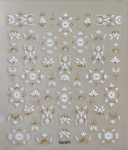Detailed view of 3D embossed nail stickers featuring gold floral patterns and abstract lines