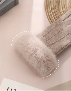 Close-up of thick faux fur cuff and classic stitched detail on thermal winter gloves