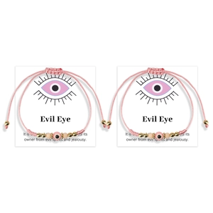 Pink evil eye braided bracelets on display card with protective meaning description
