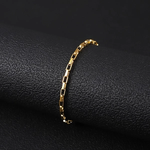 Macro shot of 18K gold plated stainless steel box chain with polished square links