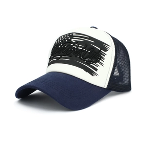 Detail of New York City 3D embroidery on breathable mesh trucker hat with US flag