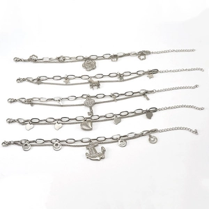 Five assorted silver titanium steel bracelets with charms like rose heart and anchor