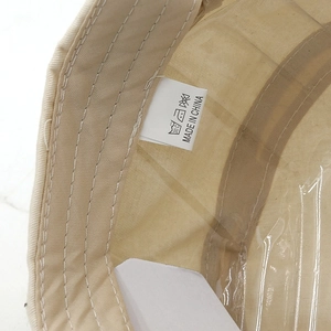 Detail of inner cotton lining with care label and quality stitching on military cap