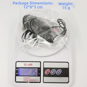 Gray plush mouse toy dimensions and weight on a digital scale for cats