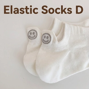 White low-cut elastic cotton socks with gray embroidered smiley face on the heel