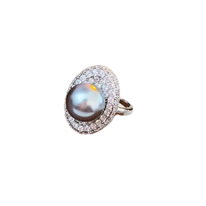Silver open ring featuring a grey pearl surrounded by double rows of zircon crystals
