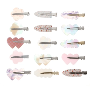 Floral and leaf pattern acetate hair clip set in various colors on a white background