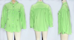 Detailed view of neon green distressed denim jacket with frayed hem and ripped details