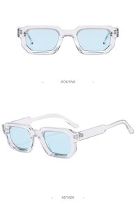 Detail view of classic square vintage sunglasses with transparent frames and blue lenses