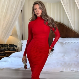 Detail of red long sleeve bodycon dress featuring elegant ruched side draping textures