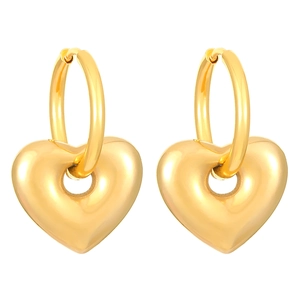 Detailed view of polished gold heart-shaped hoop earrings with a smooth metallic finish