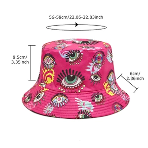 Reversible bucket hat with colorful eye pattern in hot pink, sized 56-58cm for sun protection