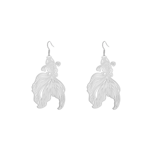 Macro shot of silver hollow-out goldfish earrings featuring detailed metal fish scales
