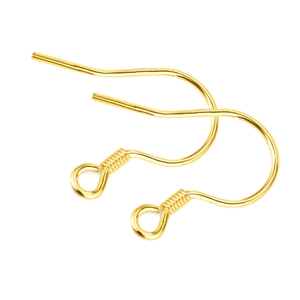 Primer plano de ganchos dorados para pendientes con espiral y bola para joyería DIY