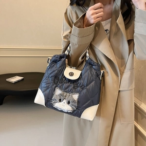 Quilted navy blue down tote bag with plush cat patch and woven handles for women