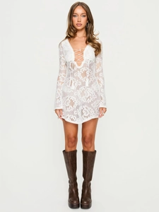 Bohemian white lace crochet mini dress with bell sleeves and deep V-neck tie detail