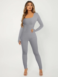 Detail of grey long sleeve ribbed jumpsuit showing high-elasticity fabric and slim fit design