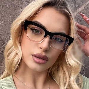 Close-up of retro square cat-eye glasses with two-tone black and transparent frames