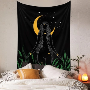 Artistic moon and female silhouette tapestry hanging on a white wall in a cozy bedroom