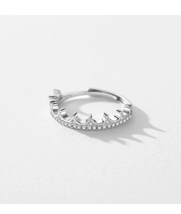 Macro shot of S925 sterling silver crown ring with sparkling pavé crystals and open band
