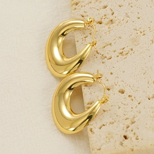 Polished gold hollow U-shaped drop earrings on stone minimalist style for women