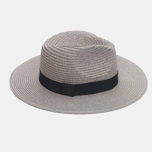 Detailed close-up of woven gray straw texture and black ribbon on a classic panama hat