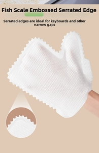 Detail of fish scale embossed non-woven cleaning gloves with serrated edge for dust removal