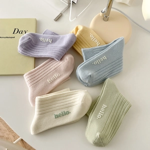 Six-pair pack of macaron-colored cotton socks with 'hello' embroidery on rib-knit fabric