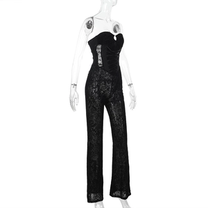 Detail of black lace jumpsuit featuring lace-up bodice and structured boning details
