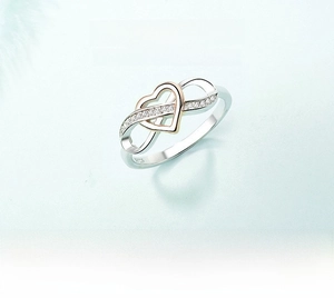 Detail view of S925 silver ring featuring heart and infinity design with cubic zirconia