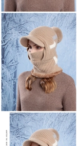 Detail of winter knitted hood with fleece lining, faux fur pompom and geometric patterns