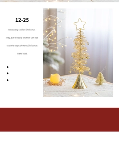 Close-up of golden iron Christmas tree with star topper and bells on white faux fur