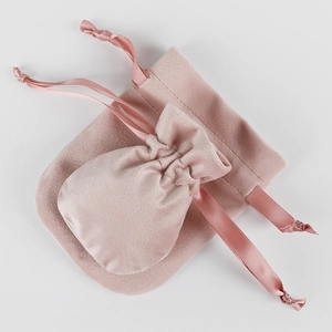 Pink velvet drawstring jewelry pouches in two sizes with elegant silk ribbon ties