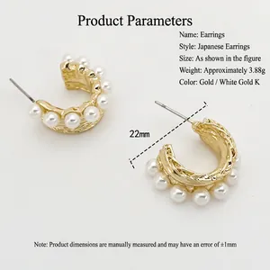 Golden C-shaped textured metal earrings with pearls, 22mm diameter and 3.88g weight