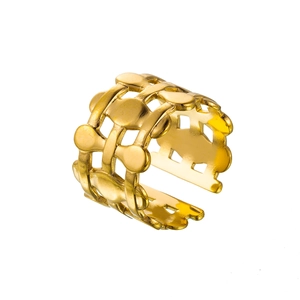 Detailed view of hollow geometric sun and heart patterns on an 18k gold plated steel ring