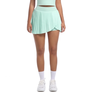 Detail of pleated mint green tennis skort showing wide elastic waistband and fine pleats