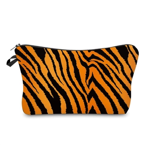 Portable tiger print cosmetic bag with orange and black stripes and black zipper