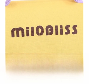 Detail of yellow grainy texture makeup bag with purple handle and mesh organizer