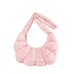 Light pink quilted dumpling bag with puffy pleated texture and integrated shoulder strap